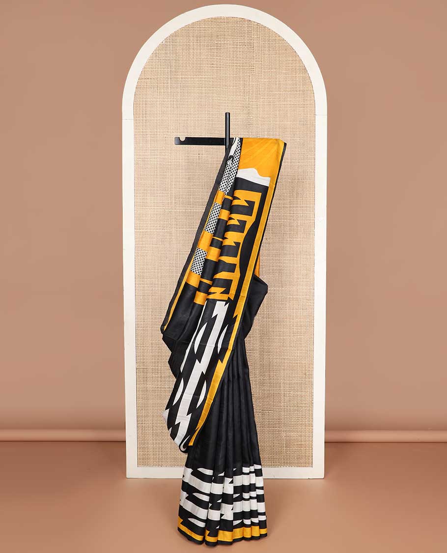 Black abstract design printed silk saree with contrast border & floral design pallu