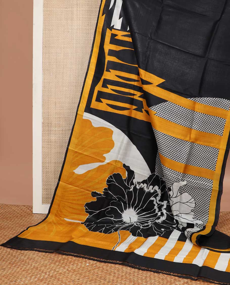 Black abstract design printed silk saree with contrast border & floral design pallu