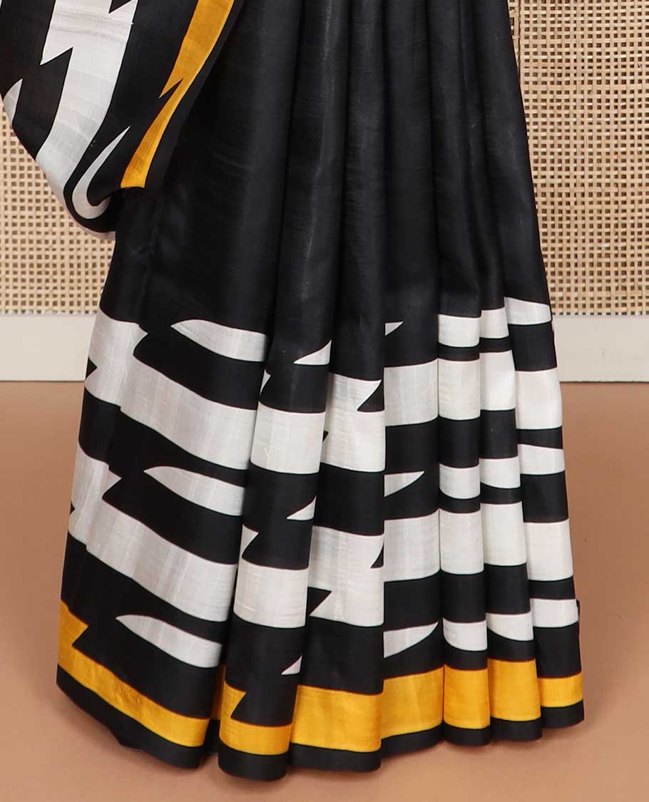 Black abstract design printed silk saree with contrast border & floral design pallu