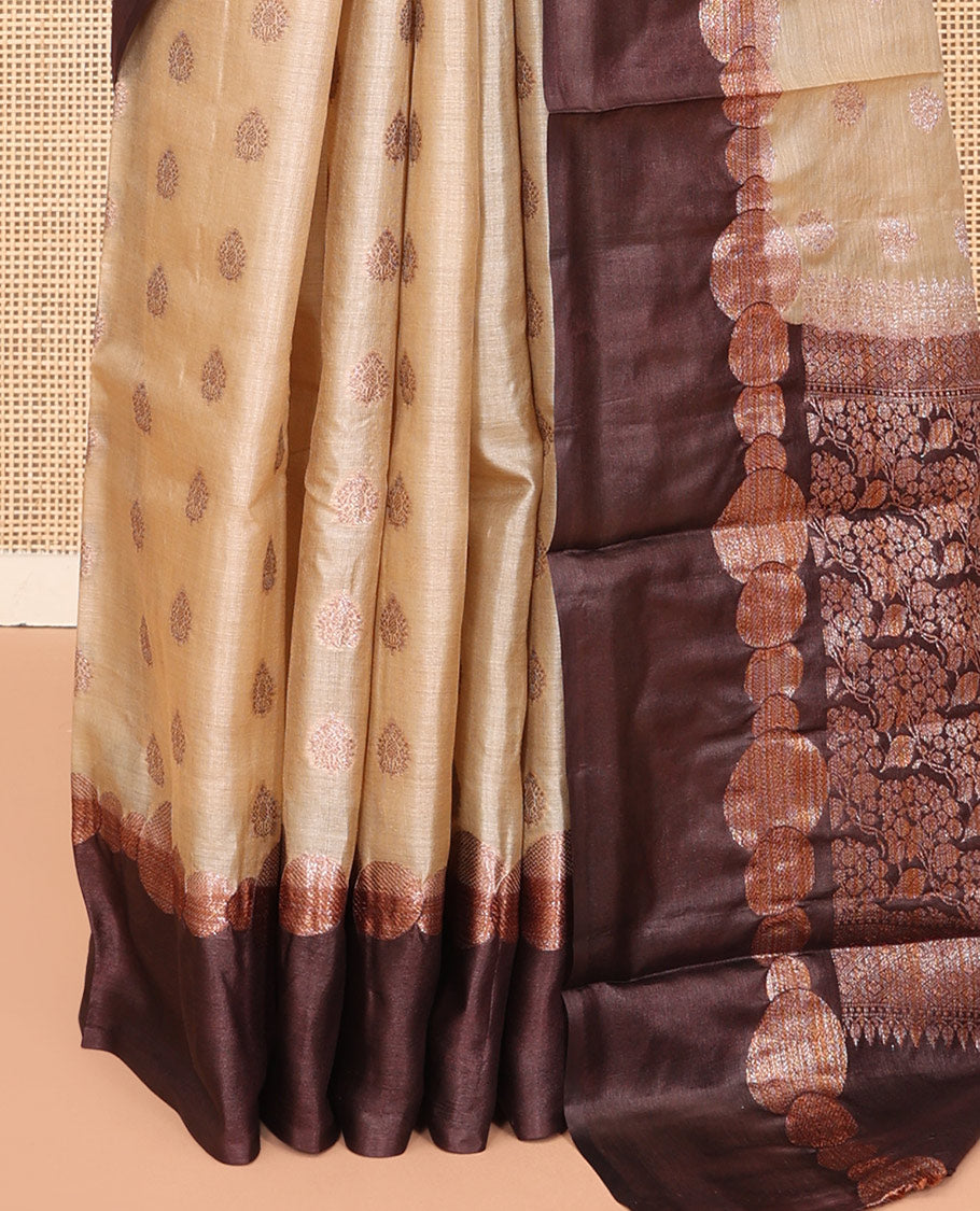 Sandal Tussar Silk Saree Features Buttas, Complemented by a Contrast Geometric Zari Border, Intricately Designed Pallu, and a Contrast Blouse