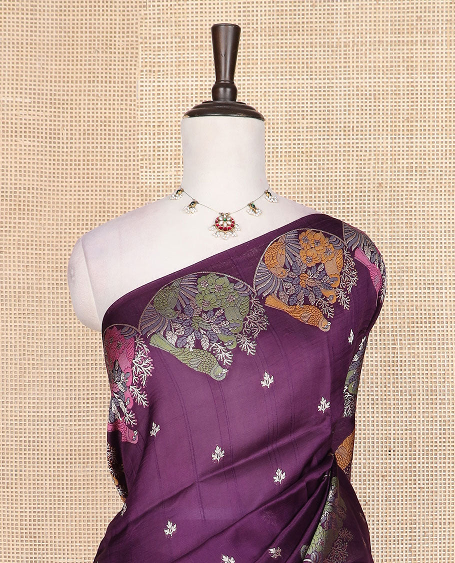 Purple Matka silk saree features rudraksham motifs, scallop floral motifs and bird embossed thread embroidery border