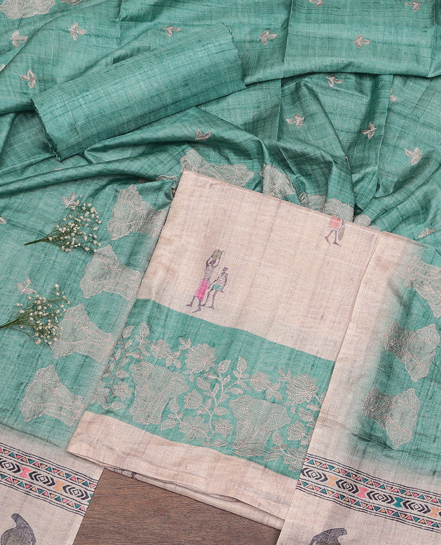Chikku-Turquoise Semi-Tussar Material Churidar Set, Bedecked with Human-Animal Motif Top, a Contrast Bottom, and Leaf-Elephant Motif Dupatta