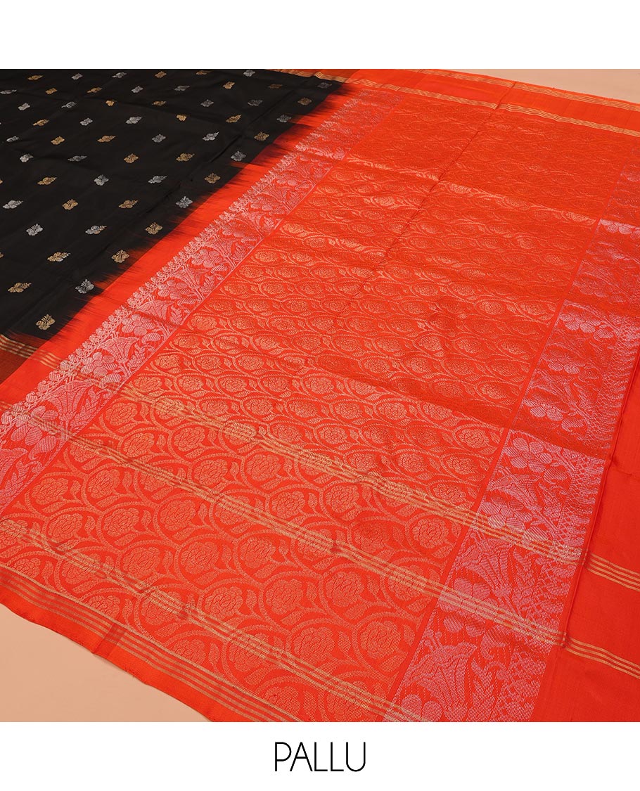 Inky Black Uppada Silk Saree Enlivened With Zari Buttas, Captivating Contrast Border Featuring Zari Stripes And Peacock Motifs, Pallu Depicting Rose Flower-Enclosed Mughal-Style Arches, And Paired With A Contrast Blouse