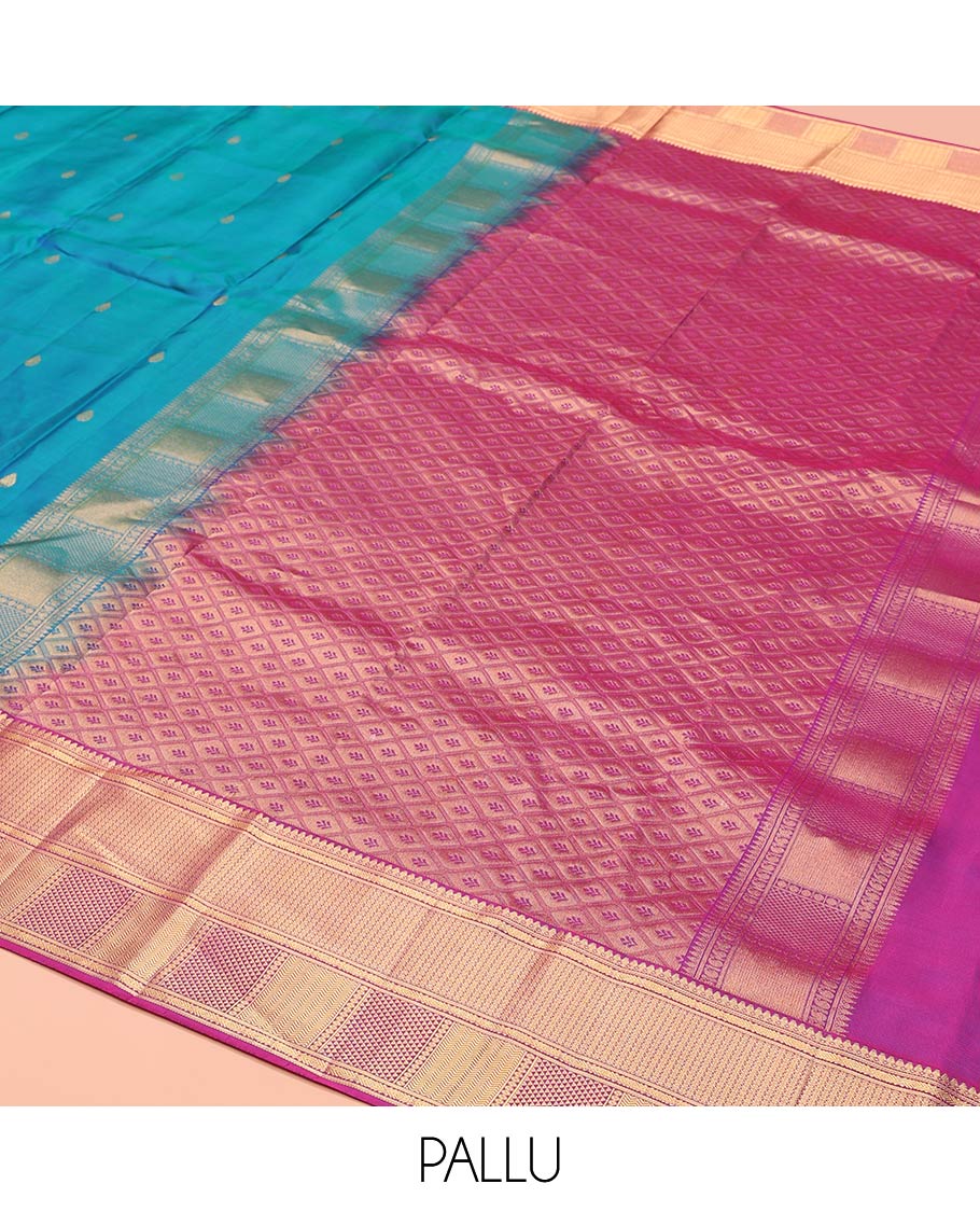 Blue Vasundhara Lite-Silk Mix Saree Highlighted with Zari Buttas on Its Body, Complemented by a Contrast Border of Thilakam Mokku, Ara Maadam, Vanki, and Then Kuli Kann Designs, Pallu Elevated with Jaal Designs, and Paired with a Contrast Blouse