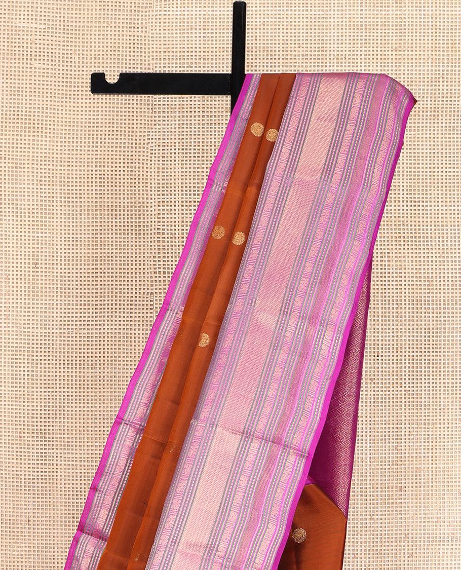 Rust Orange Vasundhara Lite Silk Mix Saree, Showcasing with Zari Buttas, Complemented by a Contrast Border of Thilakam Mokku, Banaras, Mayil, Yaanai, and Mayil Kann Designs, Artfully Detailed Pallu of Jaal Designs, and Paired with a Contrast Blouse