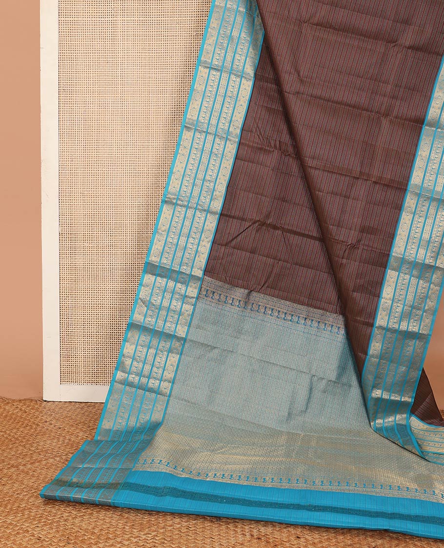 Brown striped Vasundhara silk mix saree, contrast border of muthu, paisa, and mayil designs, and jaal pallu