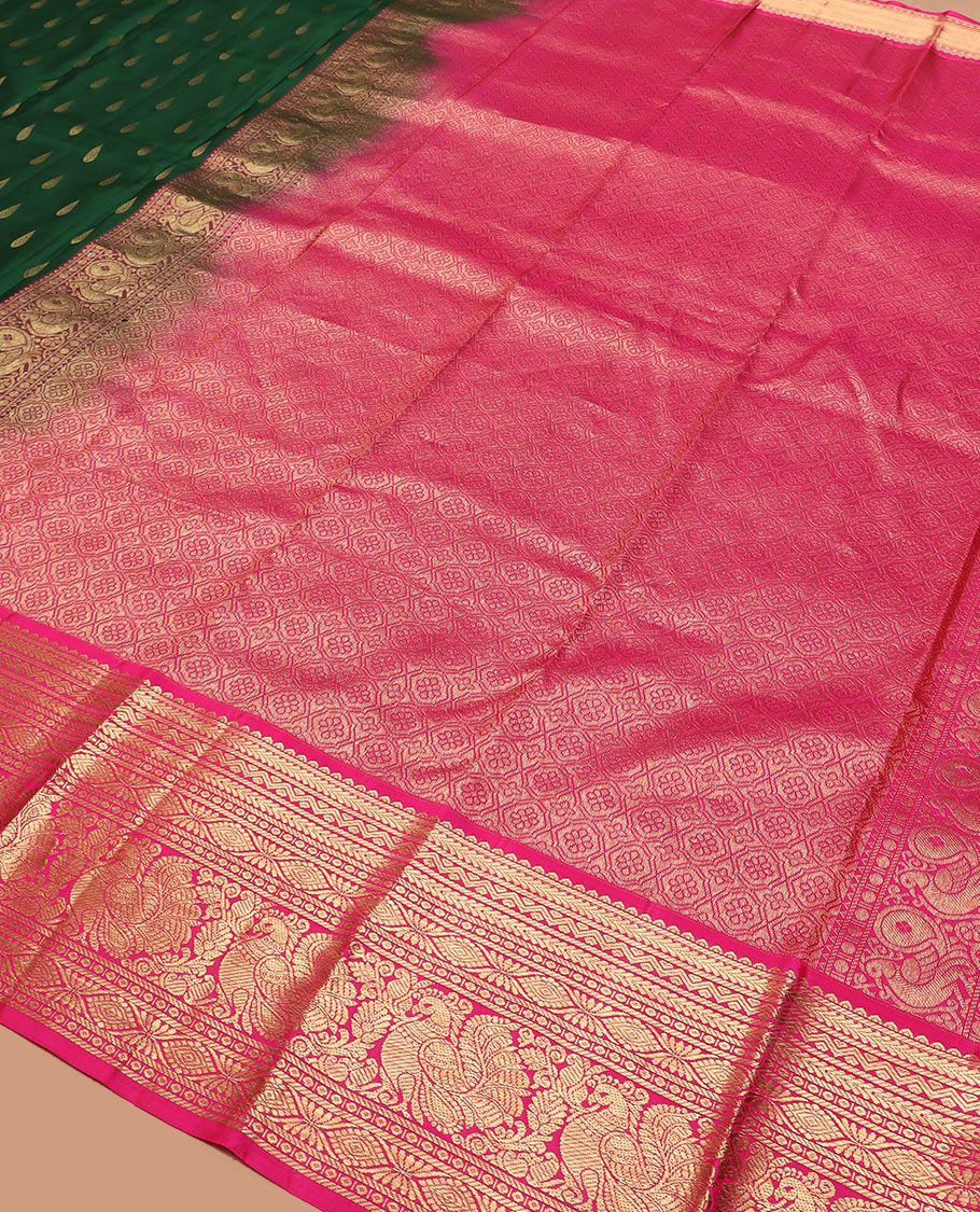 Green thilakam buttas silk saree, contrast border of rekku, muthu, kathir, neli, laddu kamalam, and mayil designs, and jaal pallu