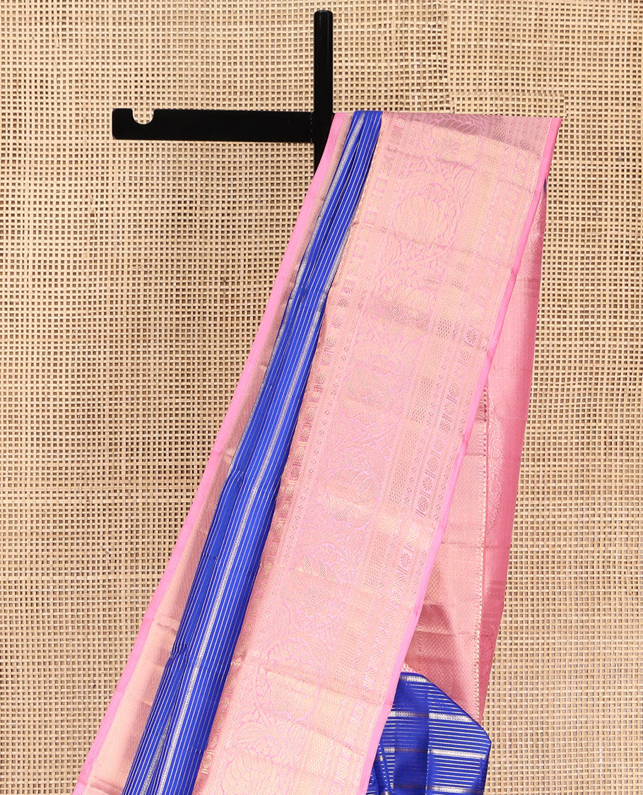 Blue Vasundhara Silk Saree, Beautifully Embellished with Zari Stripes All Over Its Body, Complemented by Contrast Border of Mayil Kann, Rudraksham, and Kodi Visiry Designs, Intricately Designed Pallu, and Paired with a Contrast Blouse