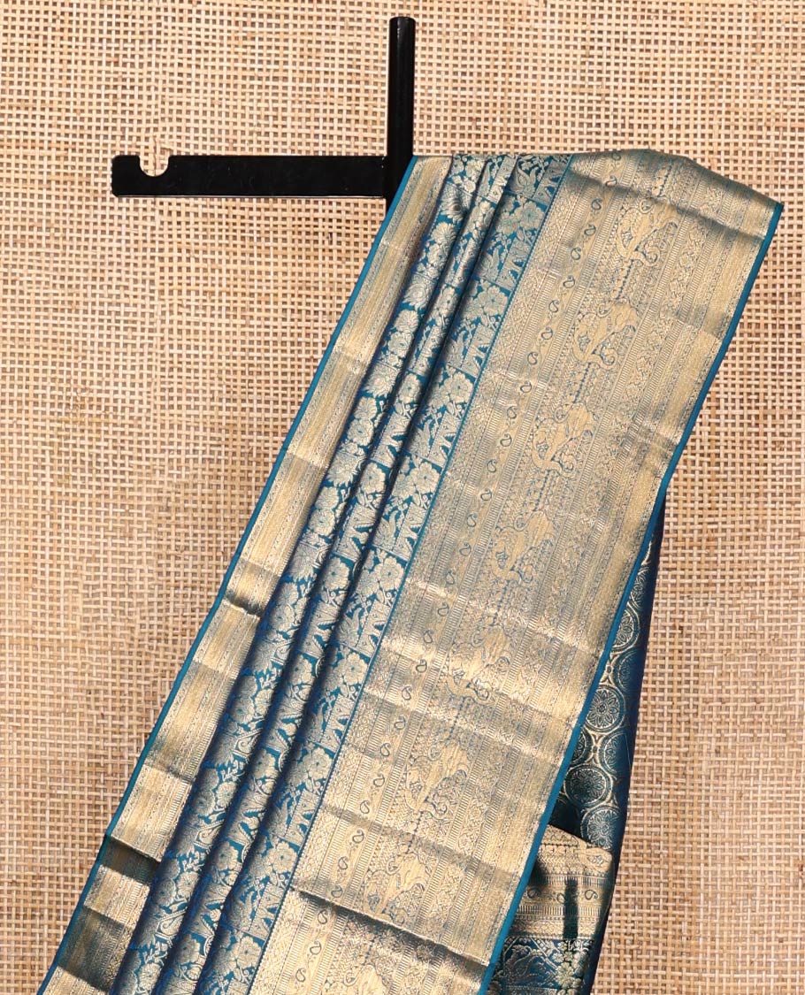 Blue Kanchipuram Wedding Silk Saree, Meticulously Crafted with Jacquard Design on Its Body, Highlighted by Zari Border of Cross Kamalam, Kodi Manga, Muthu, Kathir, Mayil Kann, and Yaali Designs, Chakram Design Pallu, and Paired with a Matching Blouse
