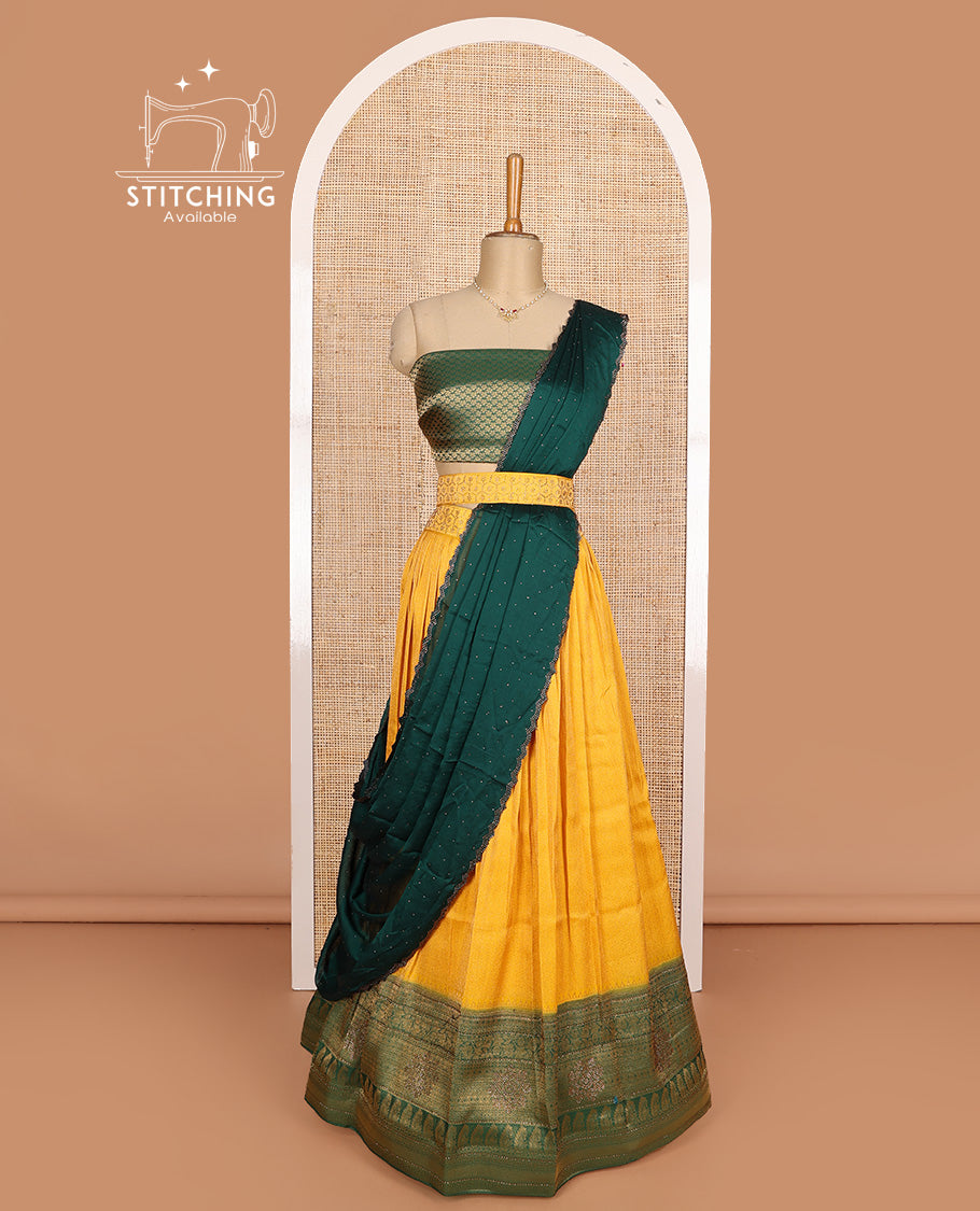 Mango yellow art silk half-saree, brocade with contrast traditional border skirt, contrast brocade blouse, scallop stone work dhavani, and detachable belt