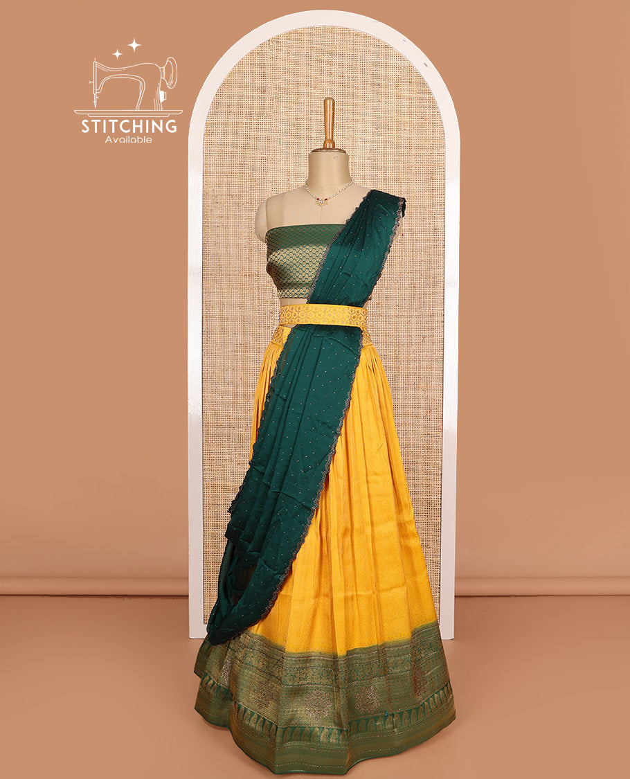 Mango yellow art silk half-saree, brocade with contrast traditional border skirt, contrast brocade blouse, scallop stone work dhavani, and detachable belt