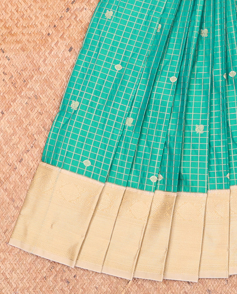 Green Budget Silk Saree Embellished with Peacock Chakram Buttas and Micro-Checks, Complemented by a Contrast Traditional Zari Motifs Woven Border, Subtle Pallu, and Paired with a Contrast Blouse
