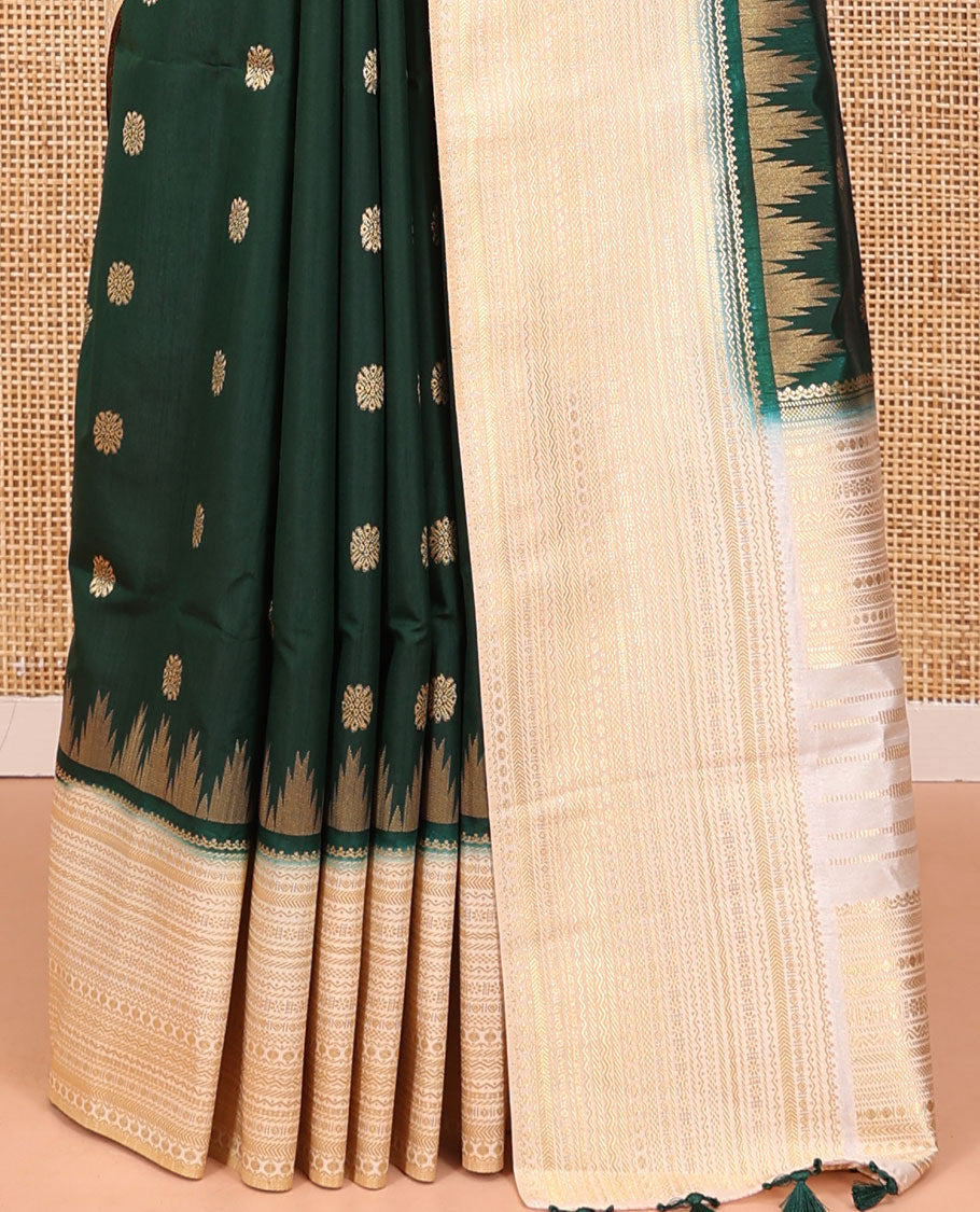 Bottle Green Dupion Silk Saree, Elevated with Zari Buttas All Over Its Body, Complemented by a Contrast Temple Traditional Zari Design Woven Border, Traditional Pallu of Temple Designs, and Paired with a Contrast Blouse