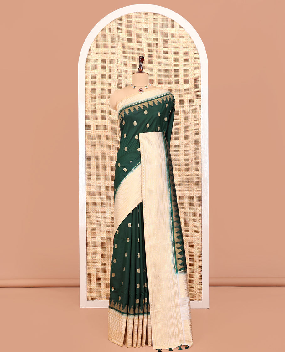 Bottle Green Dupion Silk Saree, Elevated with Zari Buttas All Over Its Body, Complemented by a Contrast Temple Traditional Zari Design Woven Border, Traditional Pallu of Temple Designs, and Paired with a Contrast Blouse