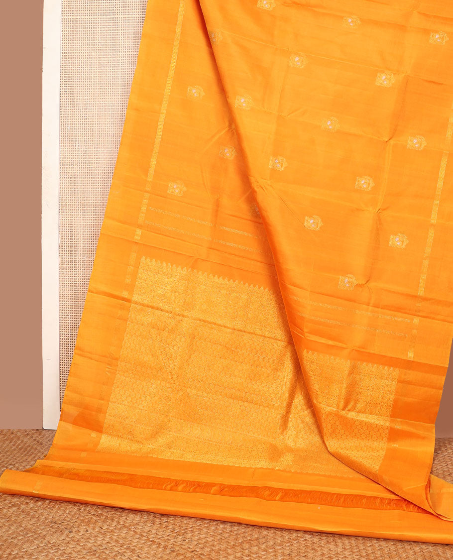 Borderless yellow zari mayil buttas Kanchipuram silk saree, self-pallu steeped with mayil & chakram motifs