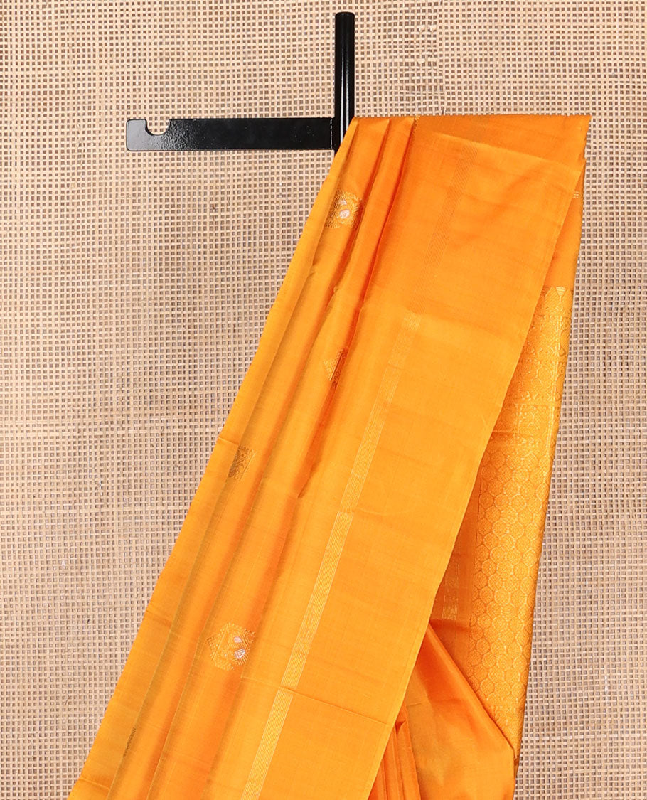 Borderless yellow zari mayil buttas Kanchipuram silk saree, self-pallu steeped with mayil & chakram motifs