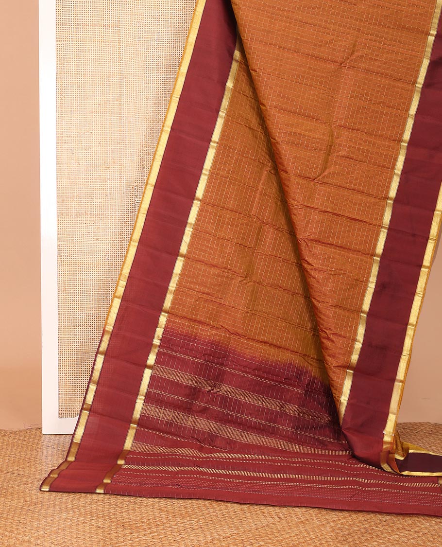 Honey color muthu kattam Kanchipuram silk saree, contrast rettai pettu border of muthu designs, and zari design pallu