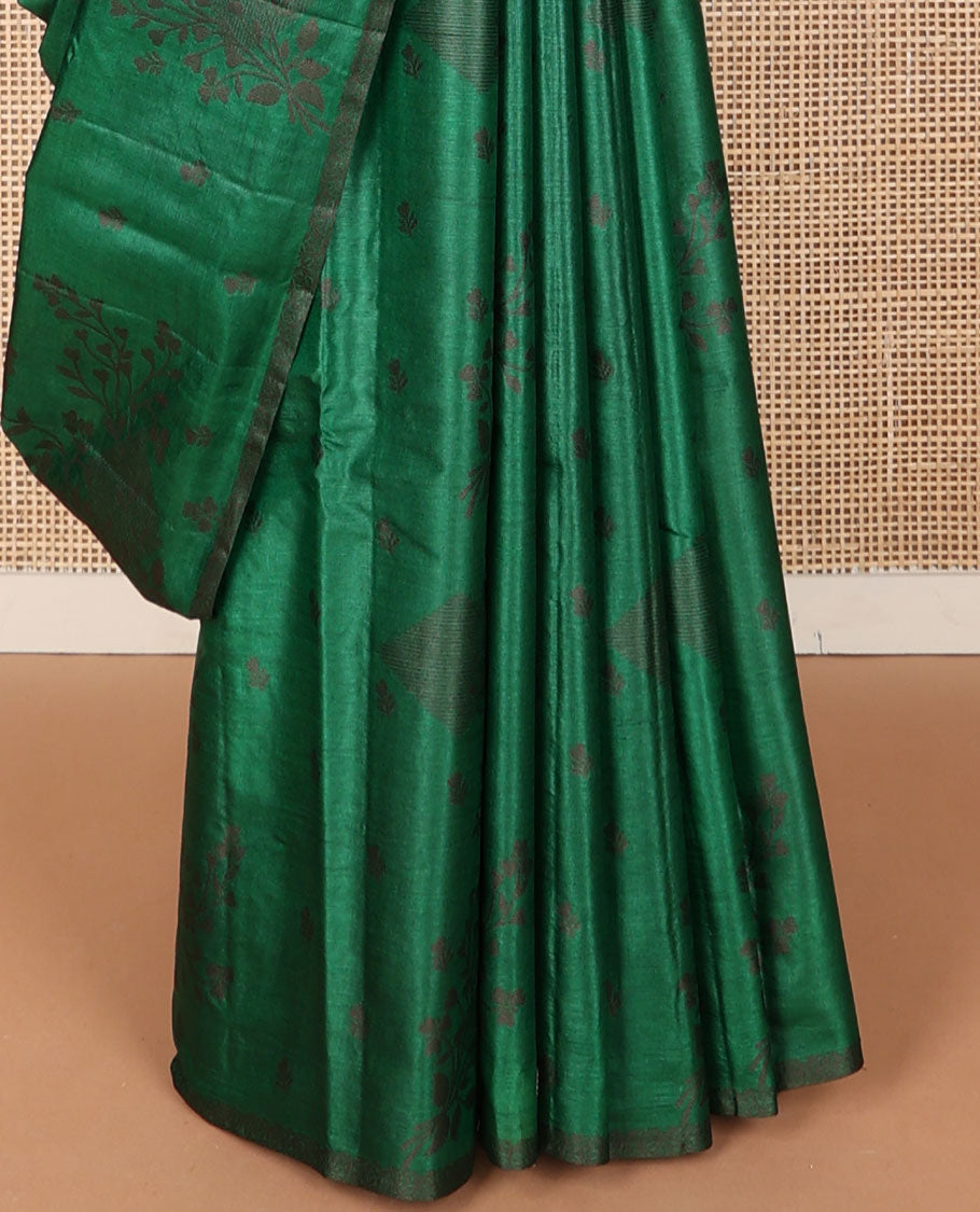 Borderless green tussar saree with floral zari buttas, zari pallu of intricate designs