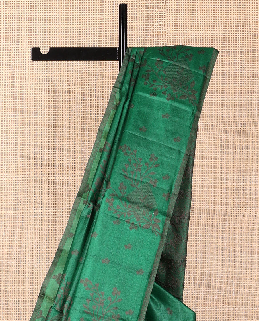 Borderless green tussar saree with floral zari buttas, zari pallu of intricate designs
