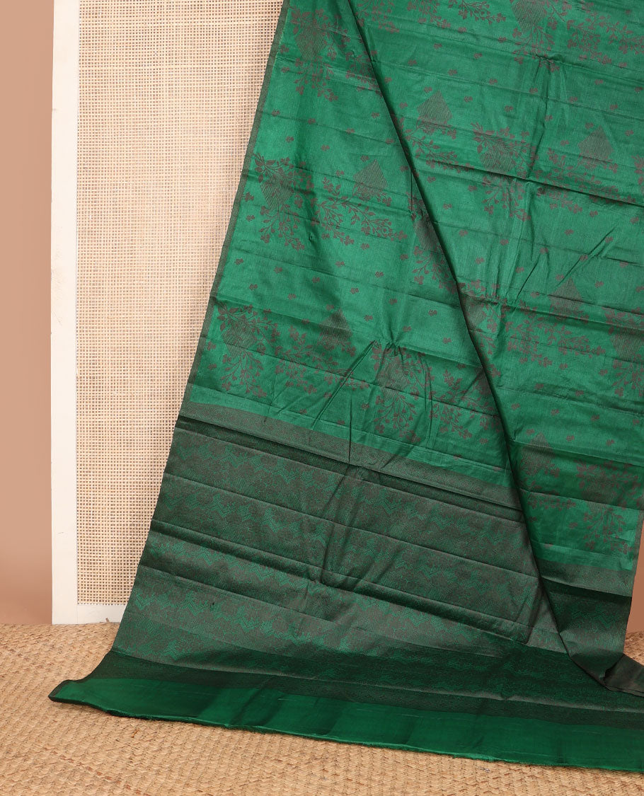 Borderless green tussar saree with floral zari buttas, zari pallu of intricate designs