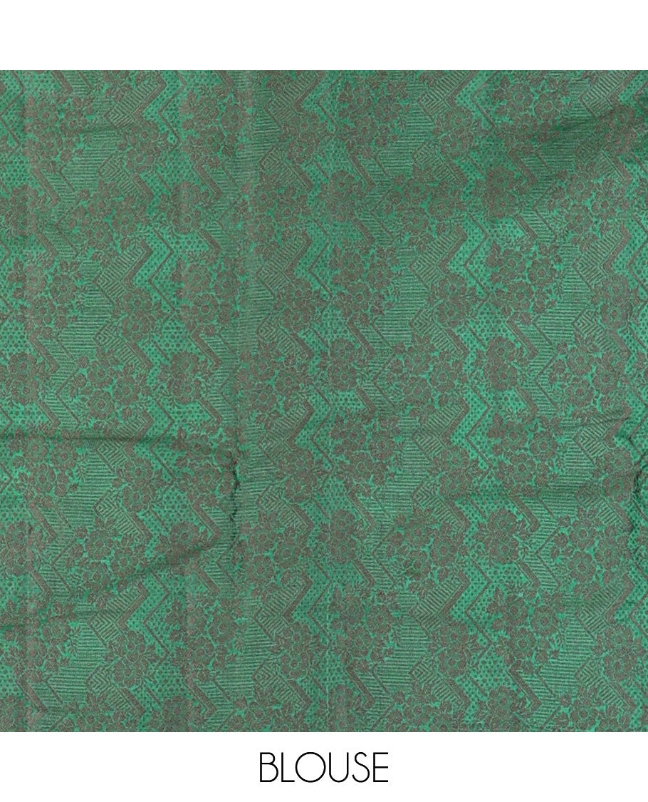 Borderless green tussar saree with floral zari buttas, zari pallu of intricate designs