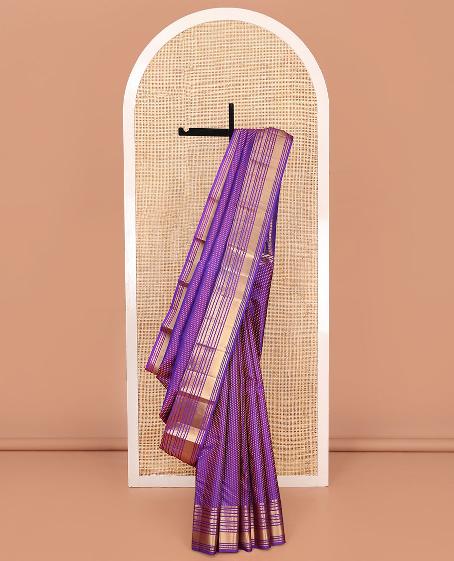Violet Vasundhara Silk Saree, Gracefully Embellished with Zari Buttas on Its Body, Highlighted by Zari Border of Manga, Cross Kamalam, Jada Nagam, Rudraksham, and Mayil Kann Designs, Grand Jaal Pallu, and Paired with a Matching Blouse