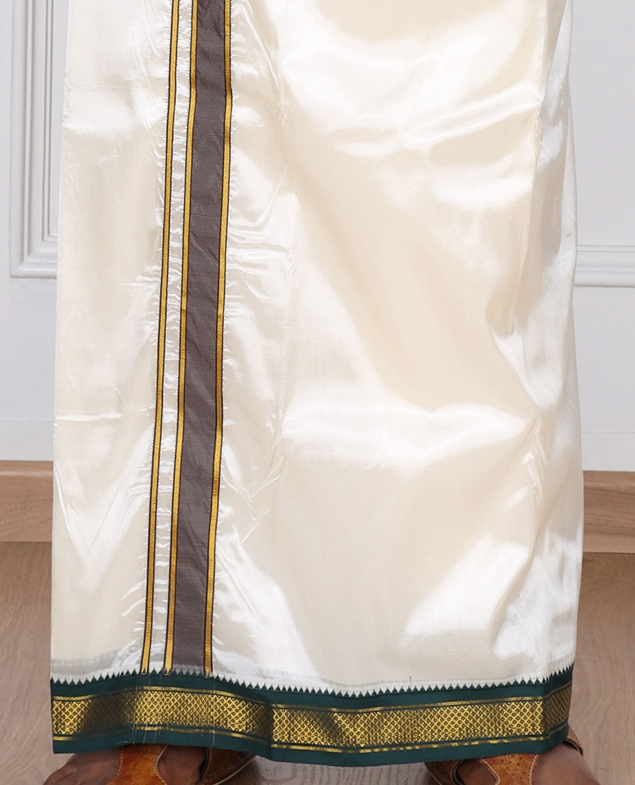 Cream art silk dhoti with contrast green zari border