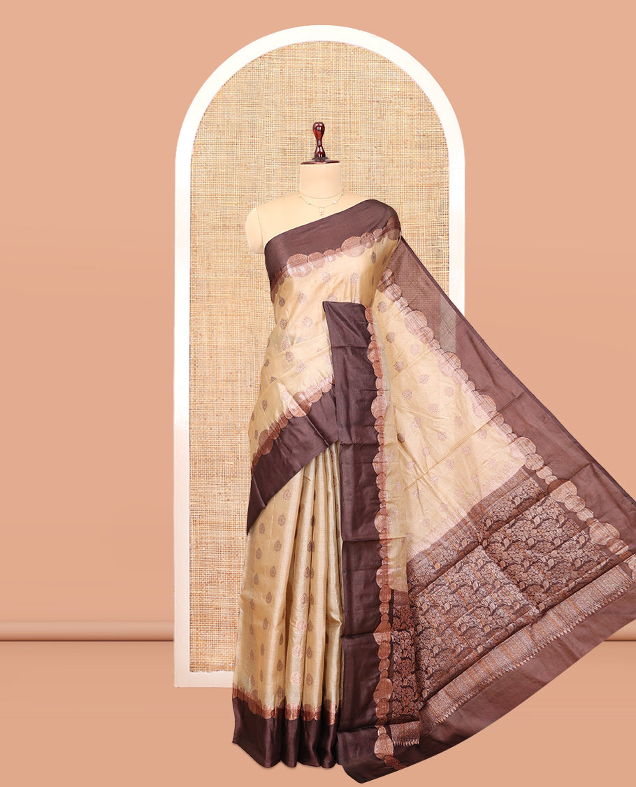 Sandal Tussar Silk Saree Features Buttas, Complemented by a Contrast Geometric Zari Border, Intricately Designed Pallu, and a Contrast Blouse