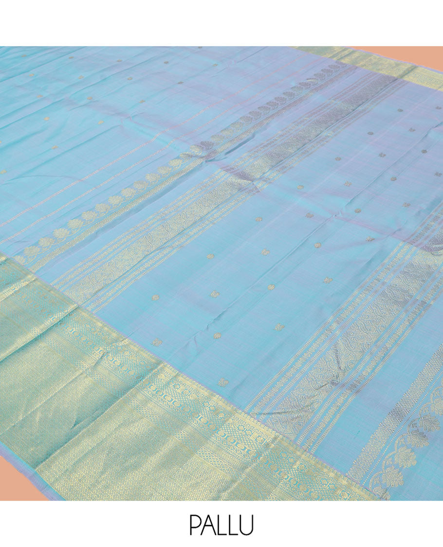 Blue Kanchipuram Silk Saree, Sparsely Woven with Zari Buttas, Highlighted by Zari Border of Manga, Neli, Mayil Kann, Kamalam, Poun, and Jaal Design, Zari Design Pallu, and a Matching Blouse