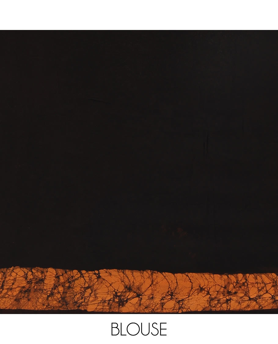 Black and mustard plain georgette saree, batik printed border, batik printed checked pallu, and a matching blouse