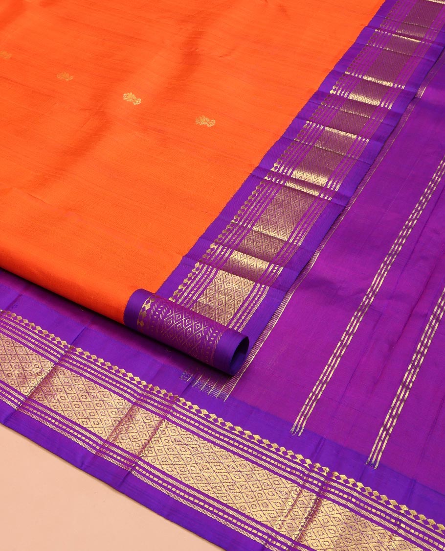 Orange Kanchipuram Silk Saree, Decked Up with Zari Buttas on Its Body, Complemented by a Contrast One-Sided Korvai Border of Panner Sombu, Banaras, Muthu, and Mayil Kann Designs, Pallu Features Zari Designs, and Comes Without a Blouse