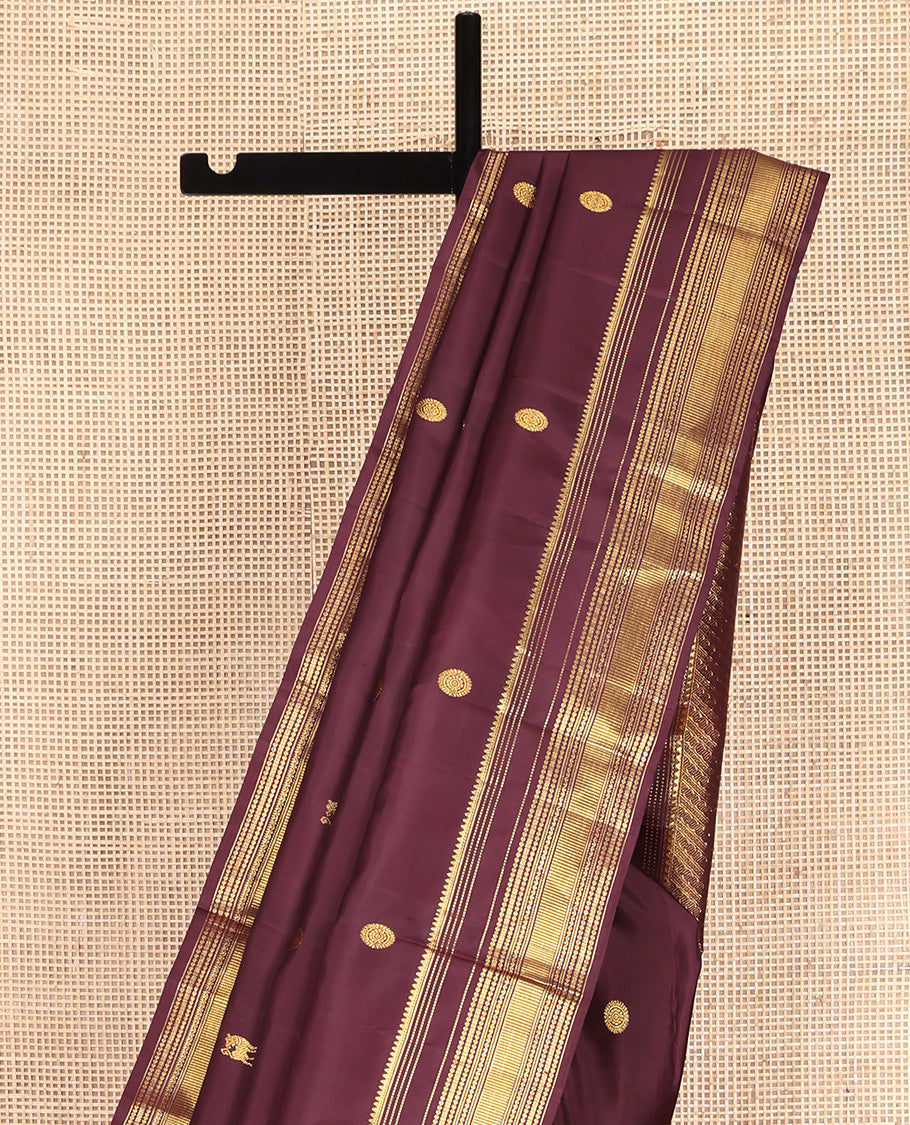 Brown Kanchipuram Silk Saree, Subtly Enriched with Yaali Buttas All Over Its Body, Highlighted by Zari Border of Thilakam, Muthu, Cross Kamalam, and Neli Designs, Grand Pallu, and Paired with a Matching Blouse