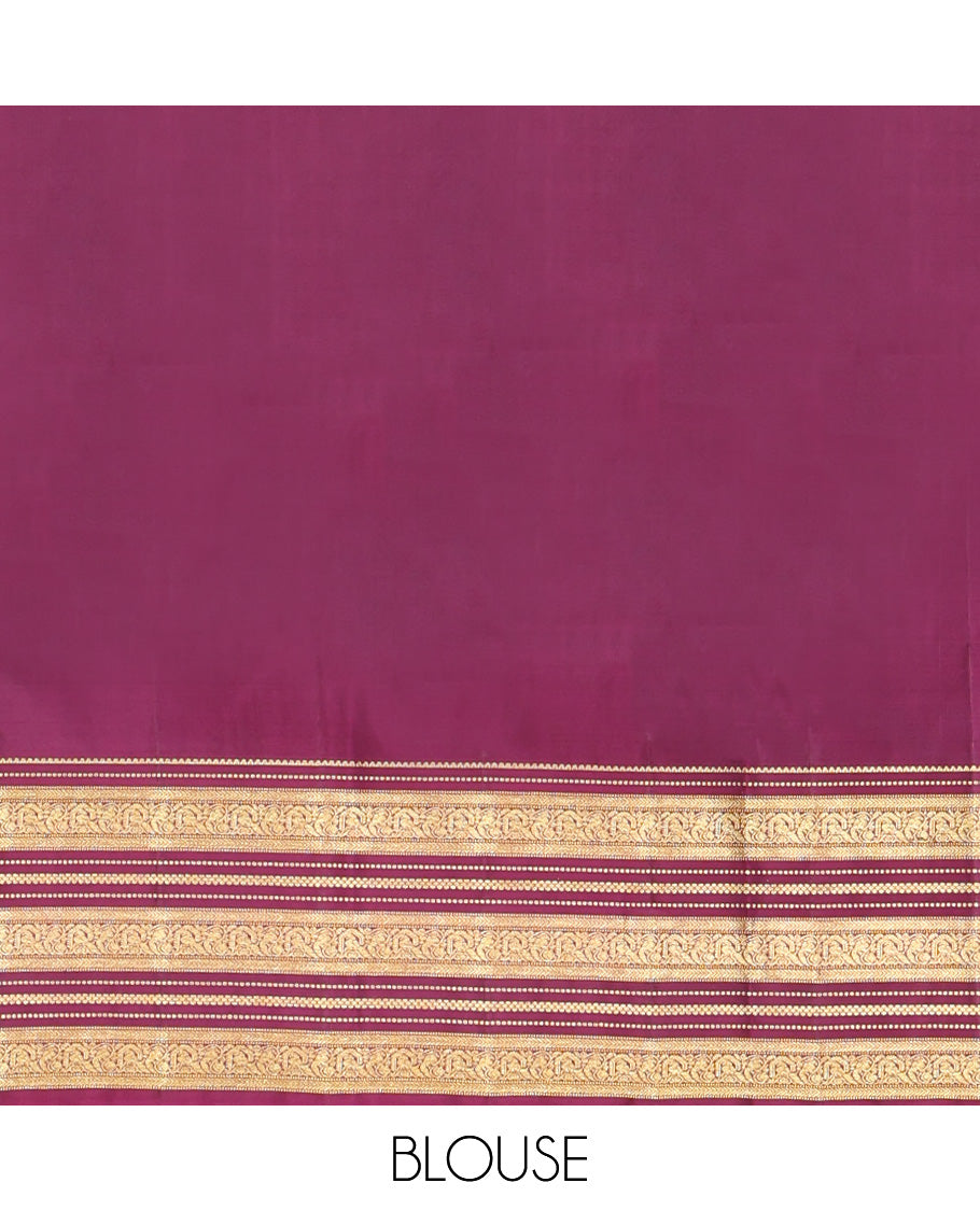 Green Vasundhara Silk Saree, Embellished with Zari Buttas All Over Its Body, Complemented by Contrast Border of Rekku, Muthu, Kathir, And Mayil Designs, Paiyadi Kattam Pallu, and Paired with a Contrast Blouse