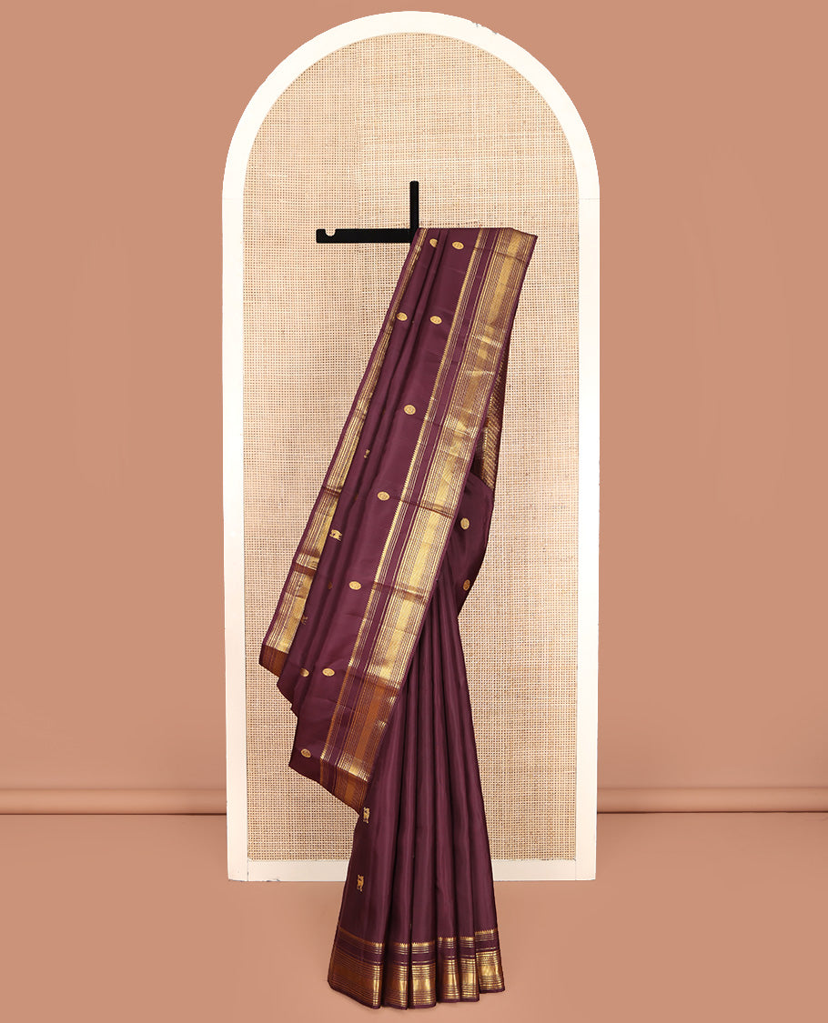 Brown Kanchipuram Silk Saree, Subtly Enriched with Yaali Buttas All Over Its Body, Highlighted by Zari Border of Thilakam, Muthu, Cross Kamalam, and Neli Designs, Grand Pallu, and Paired with a Matching Blouse