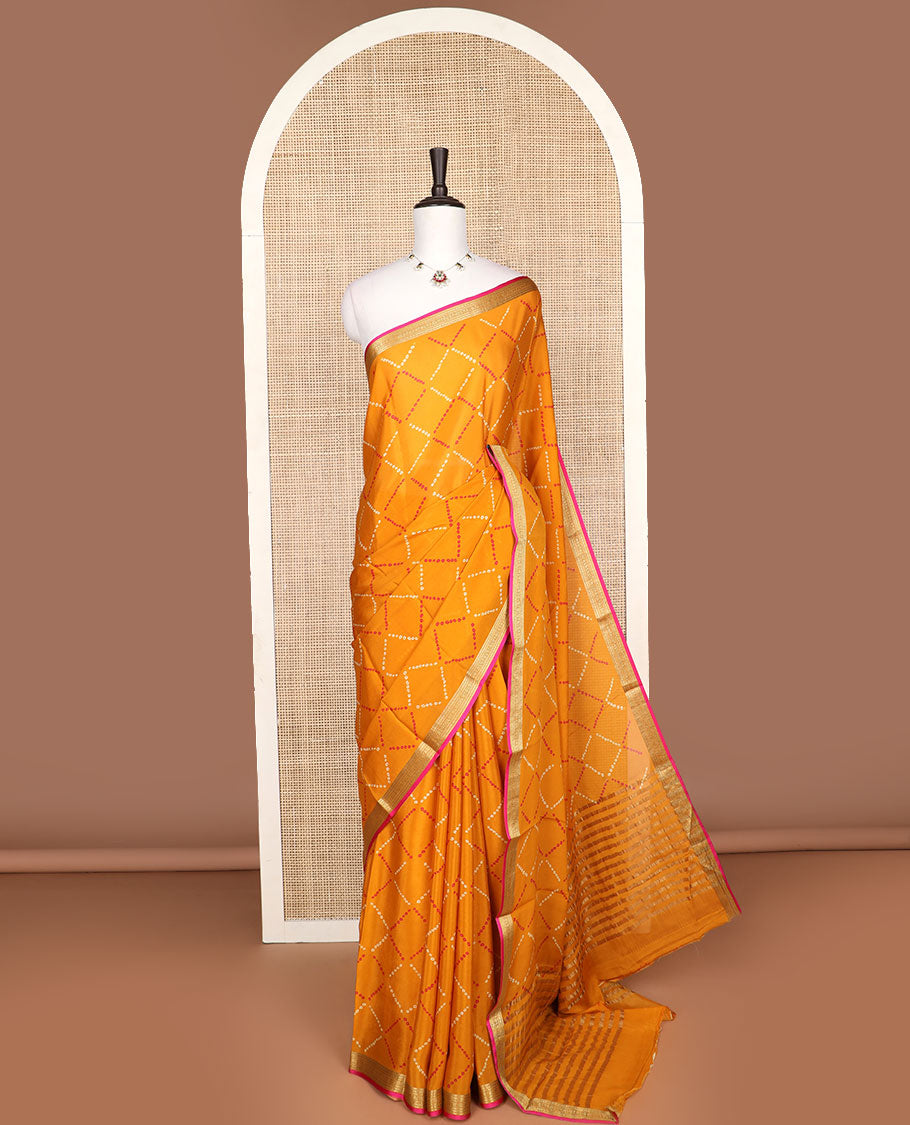 Orange bhandani style design crepe saree with contrast zari border & striped pallu
