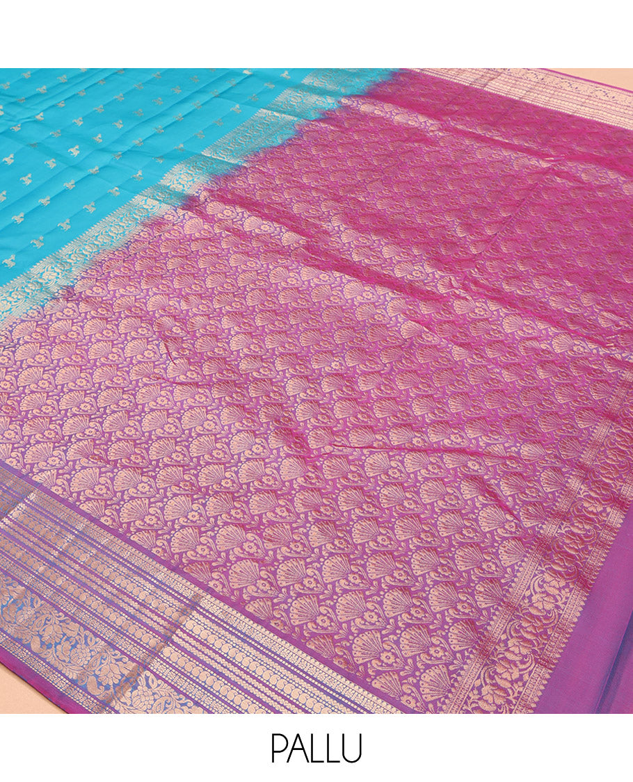 Blue Vasundhara Lite-Silk Mix Saree, Featuring Deer Buttas All Over Its Body, Complemented by a Contrast Border of Thilakam Mokku, Muthu, Kamalam, Neli, Manga, and Kodi Visiry Designs, Opulently Embellished Pallu, and Paired with a Contrast Blouse