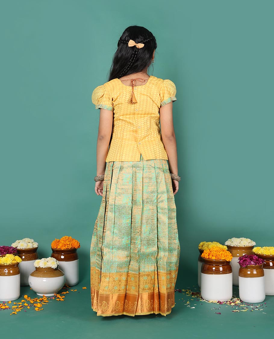 Green art silk readymade pavadai set, jacquard with contrast traditional zari border skirt, and contrast round neck embroidered puff-sleeve blouse