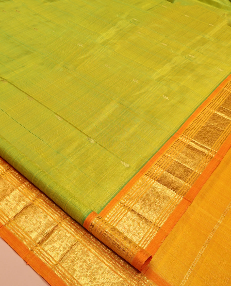 Green Kanchipuram Silk Saree, Adorned with Zari Buttas, Complemented by a Contrast One-Sided Border of Panner Sombu, Banaras, Muthu, and Jaal Designs, Zari Design Pallu, and No Blouse