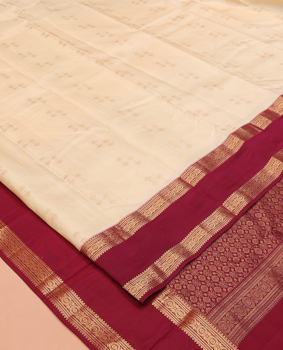 Cream Vasundhara Silk Saree, Steeped in Richness of Zari Buttas All Over Its Body, Complemented by a Contrast Rettai Pettu Border of Rekku, Muthu, and Chakram Designs, Grand Pallu, and Paired with a Contrast Blouse