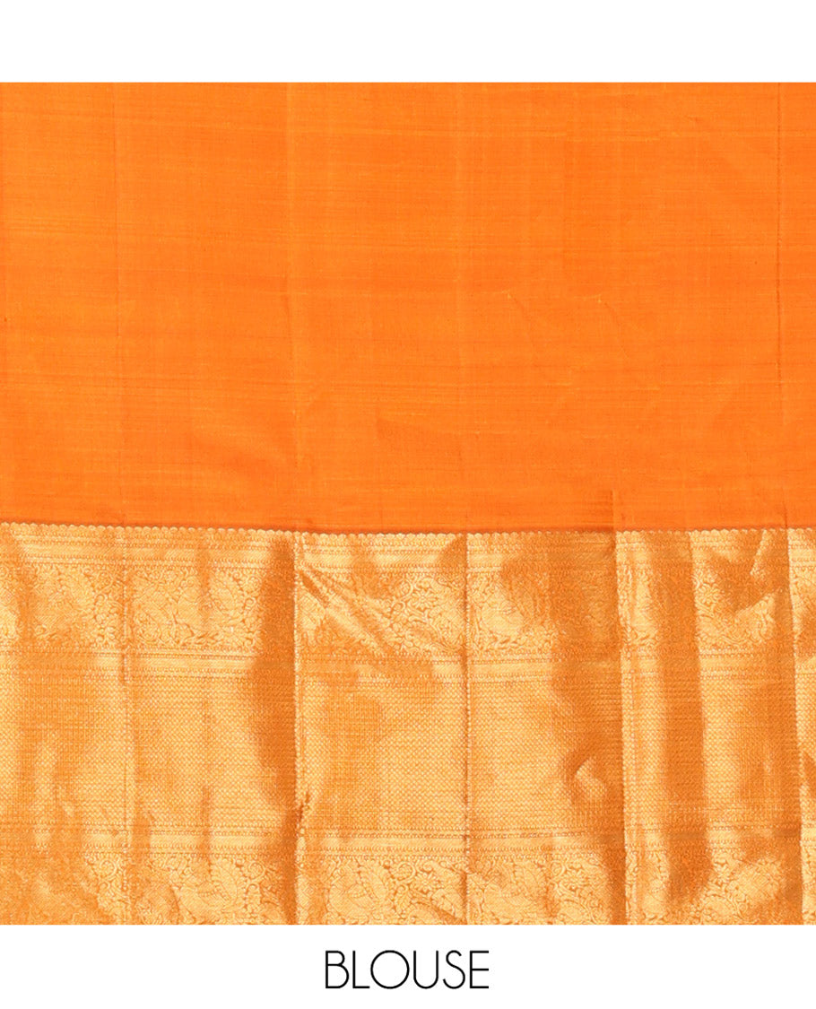 Orange Kanchipuram Silk Saree, Decked Up with Mayil Buttas All Over Its Body, Highlighted by Zari Border of Salngai, Mayil, Yaanai, and Mayil Kann Designs, Subtly Enriched Jaal Pallu, and Paired with a Matching Blouse