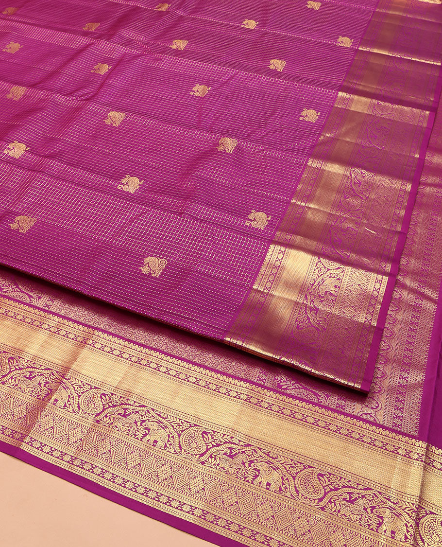 Purple Vasundhara Silk Saree, Dazzled with Zari Buttas and Zari Checks All Over Its Body, Highlighted by a Zari Border of Banaras, Muthu, Star Vanki, Manga, Kuthirai, and Yaanai Designs, Intricately Designed Pallu, and Paired with a Matching Blouse