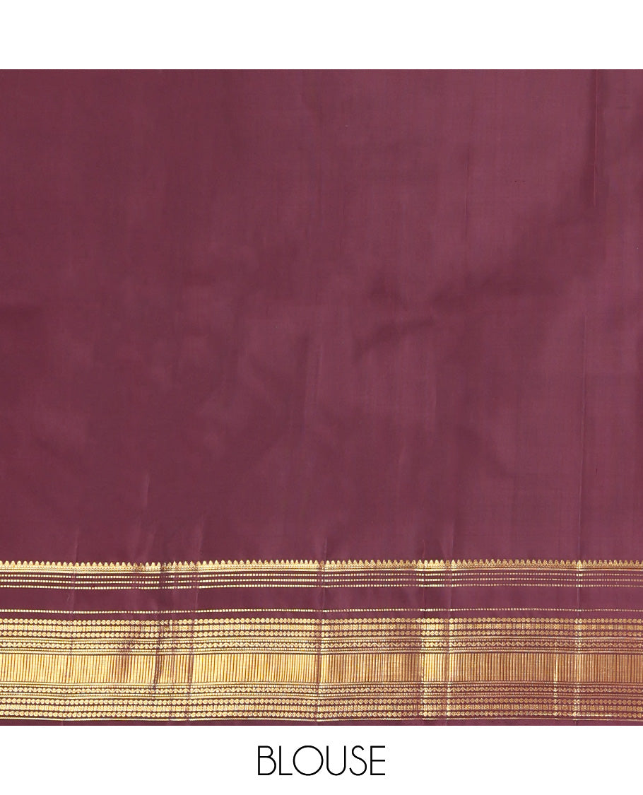 Brown Kanchipuram Silk Saree, Subtly Enriched with Yaali Buttas All Over Its Body, Highlighted by Zari Border of Thilakam, Muthu, Cross Kamalam, and Neli Designs, Grand Pallu, and Paired with a Matching Blouse