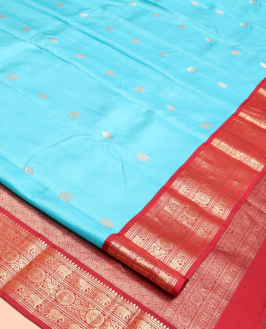 Blue Vasundhara Silk Saree, Embellished with Mayil and Yaanai Buttas Across Its Body, Complemented by a Contrast Korvai Border of Rekku, Banaras, Yaanai, and Chakram Designs, Gleaming Jaal Pallu, and Paired with a Contrast Blouse