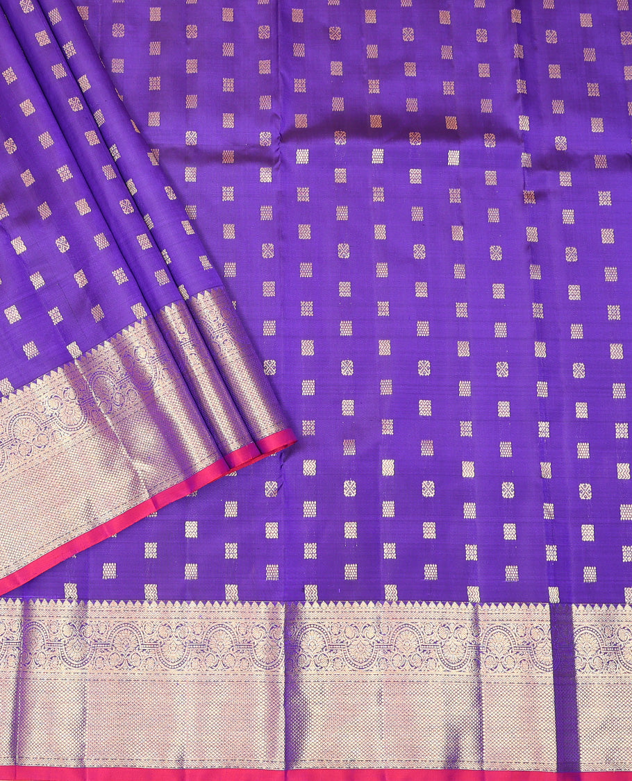 Dark Violet Pure Silk Half-Saree Beautified with Zari Buttas on Its Skirt, Complemented by a Zari Border Featuring Thilakam Mokku, Rettai Nelli, and Mayil Kann Designs, Comes with a Contrast Blouse and a Dhavani of Butta Enclosed Jaal Designs