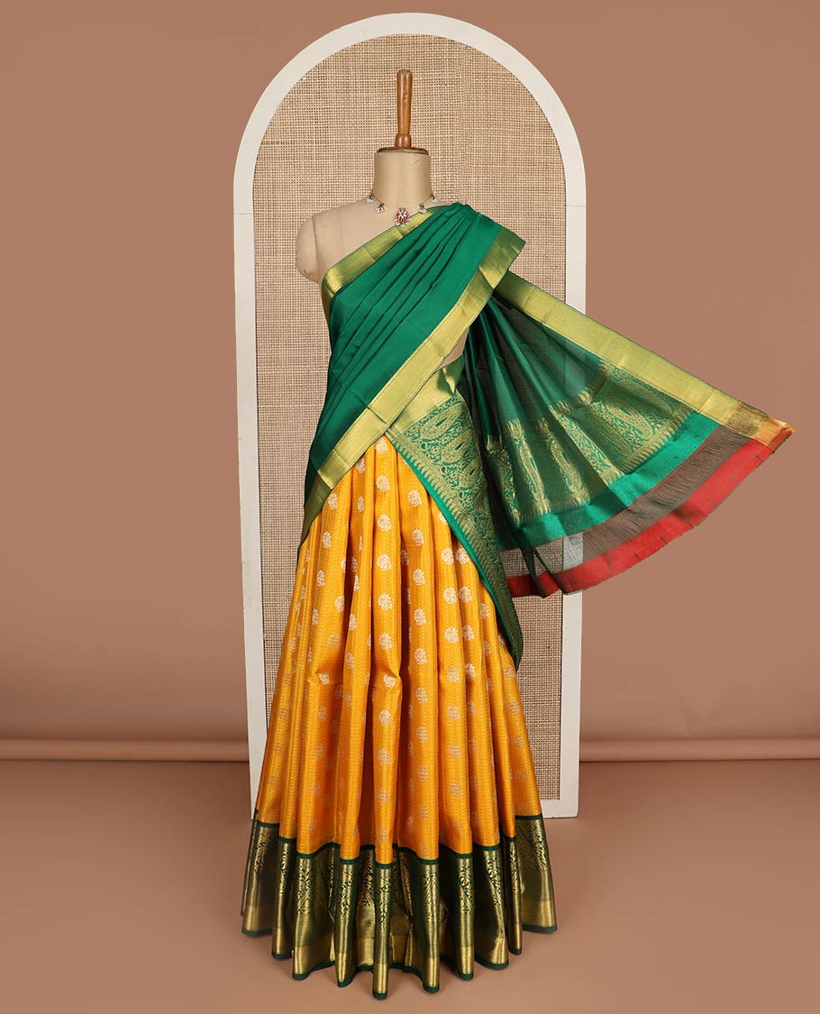 Yellow pure-silk half-saree with buttas, checks, and embossed design skirt, contrast traditional kanchi border, contrast zari design blouse, and a manga motifs woven dhavani