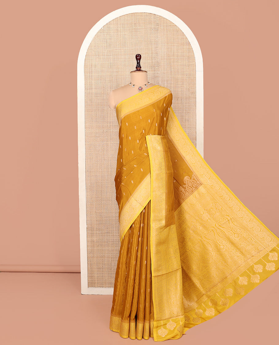 Mustard Fancy Crepe Saree, Adorned with Buttas, Complemented by a Contrast Floral Creeper Border, Intricately Designed Pallu, and a Contrast Blouse