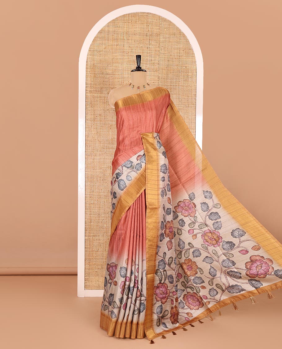 Orange plain fancy tussar saree, contrast floral printed border, floral vine printed pallu, and a contrast plain blouse