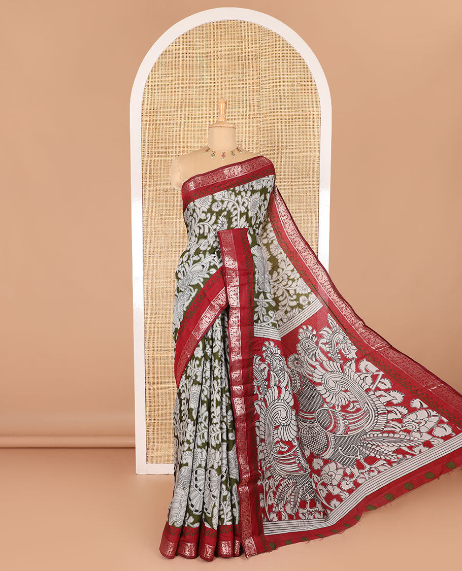 Olive kalamkari floral vine and peacock printed muslin cotton saree, contrast zari border, kalamkari peacock printed pallu, and a contrast coin buttas printed blouse