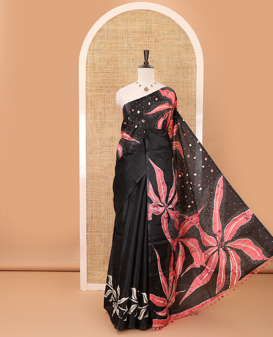 Black-base plain body khadi cotton saree with batik-style orange-color floral & dots printed on its border & pallu, plain black blouse