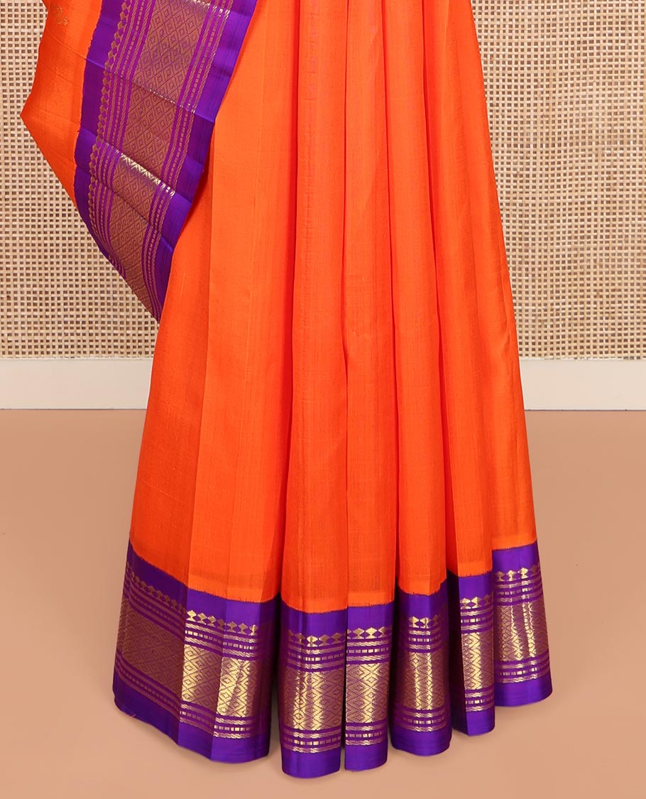 Orange Kanchipuram Silk Saree, Decked Up with Zari Buttas on Its Body, Complemented by a Contrast One-Sided Korvai Border of Panner Sombu, Banaras, Muthu, and Mayil Kann Designs, Pallu Features Zari Designs, and Comes Without a Blouse